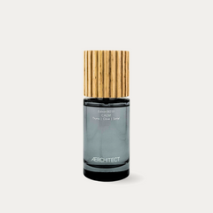 Aerchitect CALM Nervous System Reset Mist bottle with wooden cap, a thyme, clove and santal fragrance, on a greige background