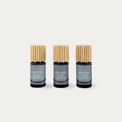 Aerchitect Mood Toolkit set of CALM, FOCUS and GROUND fragrance mists with wooden caps on a greige background