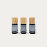 Aerchitect Mood Toolkit set of CALM, FOCUS and GROUND fragrance mists with wooden caps on a greige background